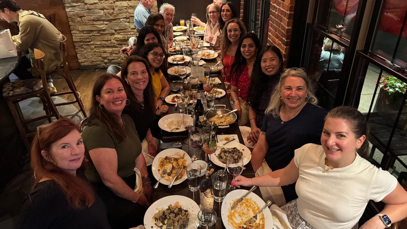 A chapter dinner in full swing around a long table