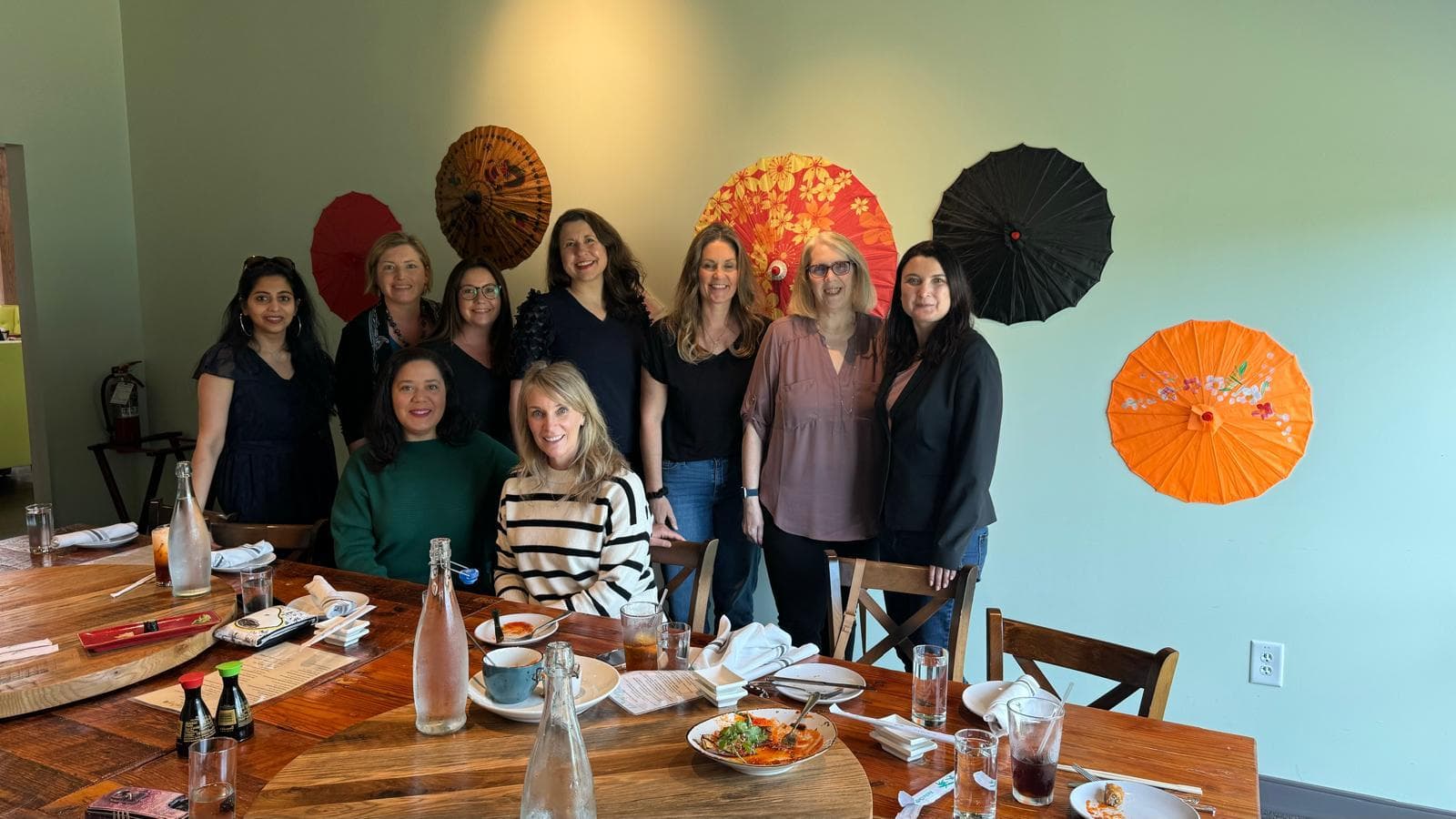 Members gathered for a photograph at a restaurant lunch