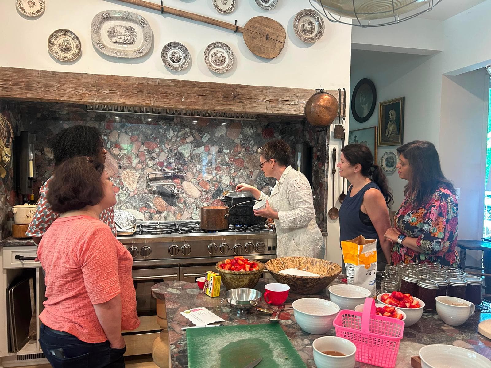 Members around a kitchen range at a preserving workshop