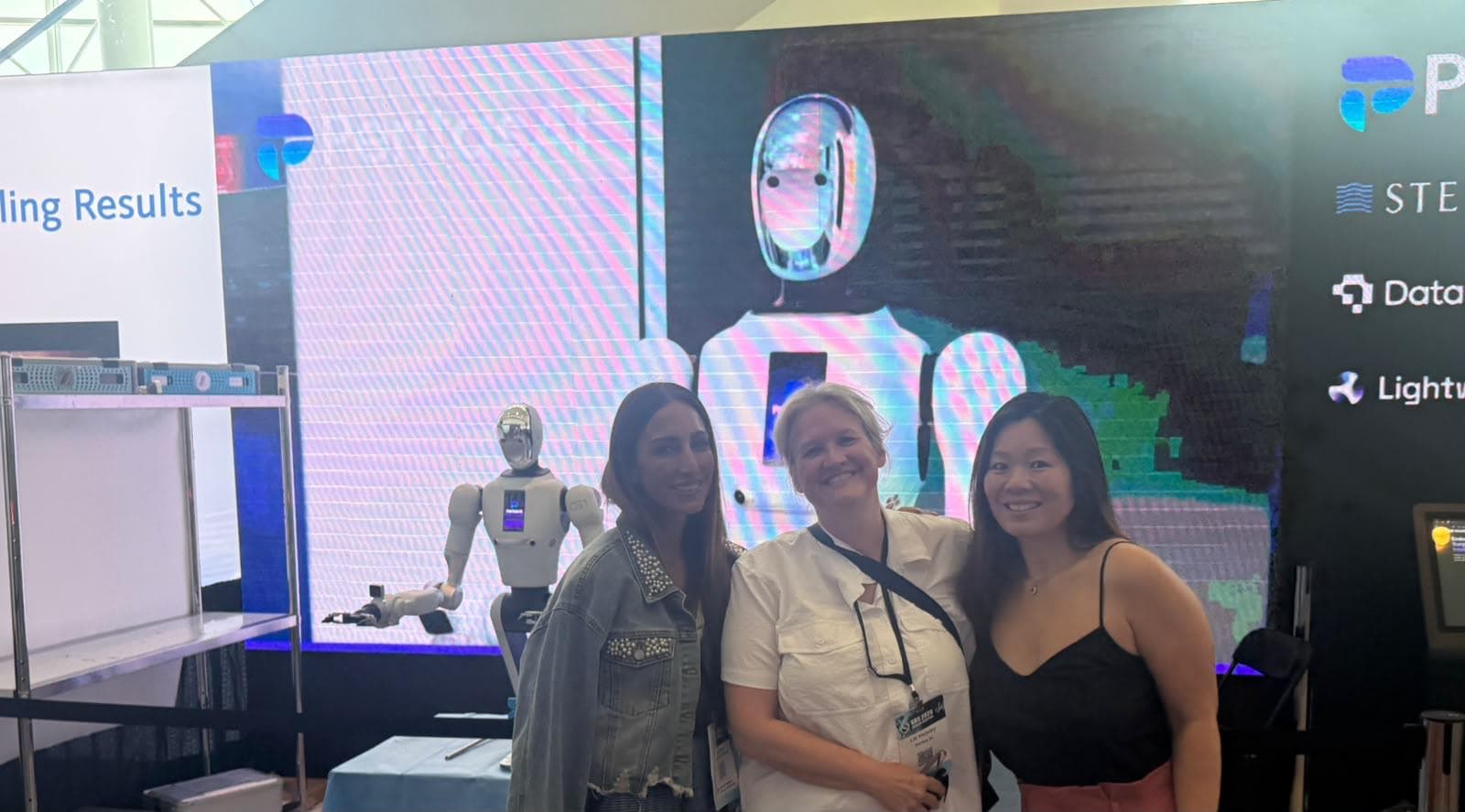 Members at a technology conference stand